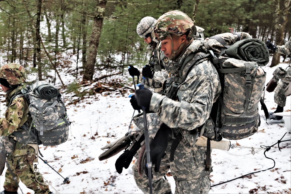 Fort McCoy Cold-Weather Operations Course students practice snowshoeing, ahkio sled use