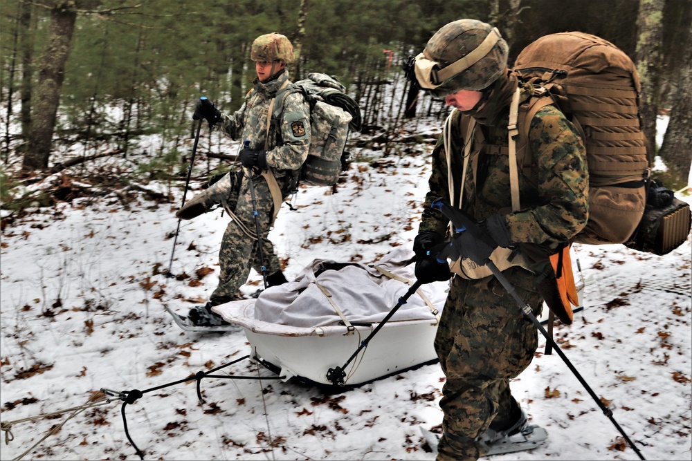 ort McCoy Cold-Weather Operations Course students practice snowshoeing, ahkio sled use