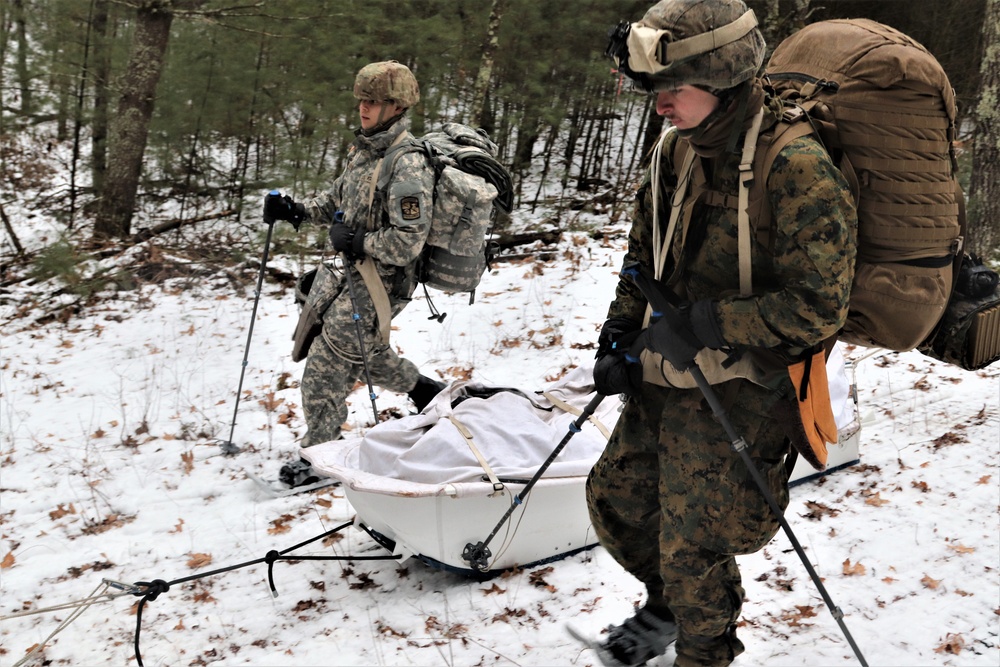 ort McCoy Cold-Weather Operations Course students practice snowshoeing, ahkio sled use