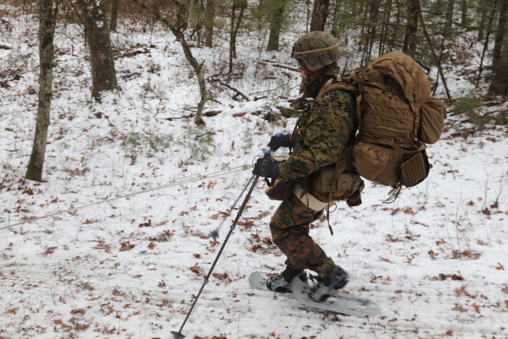 Fort McCoy Cold-Weather Operations Course students practice snowshoeing, ahkio sled use