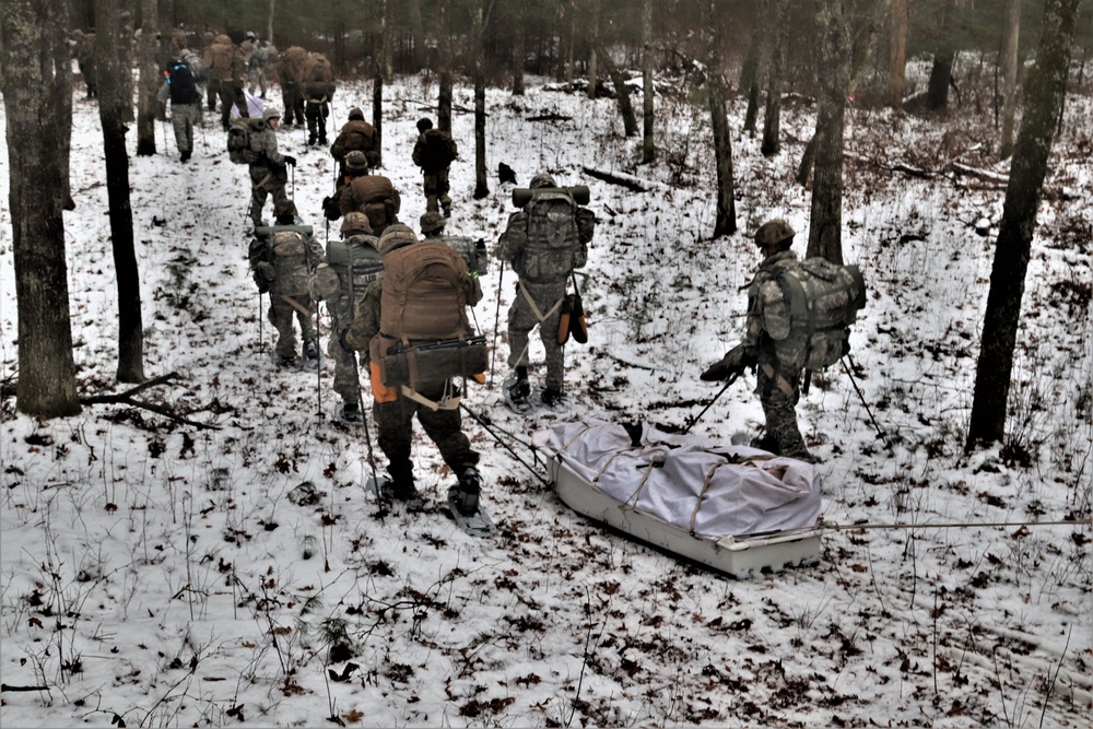 Fort McCoy Cold-Weather Operations Course students practice snowshoeing, ahkio sled use