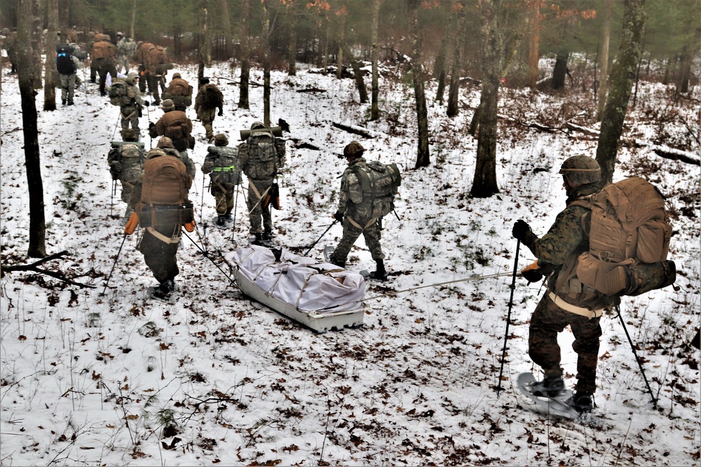 ort McCoy Cold-Weather Operations Course students practice snowshoeing, ahkio sled use