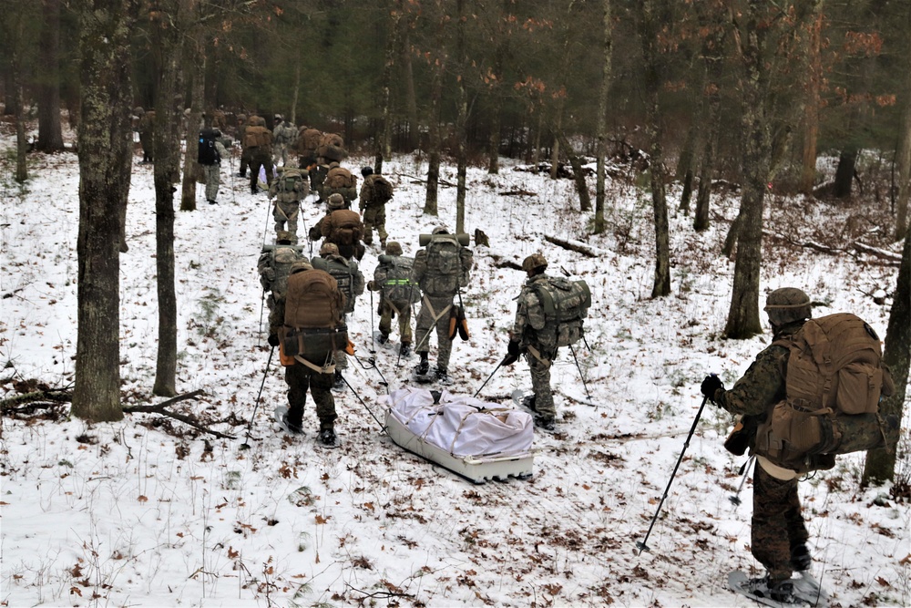 ort McCoy Cold-Weather Operations Course students practice snowshoeing, ahkio sled use