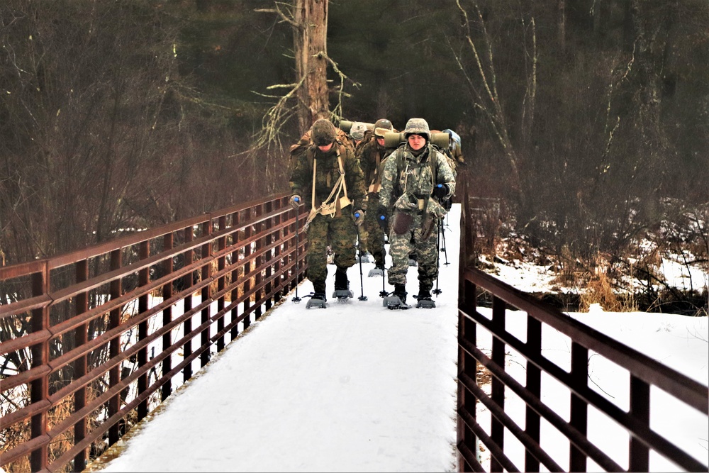 Cold-Weather Operations Course Class 20-02 students practice snowshoeing at Fort McCoy