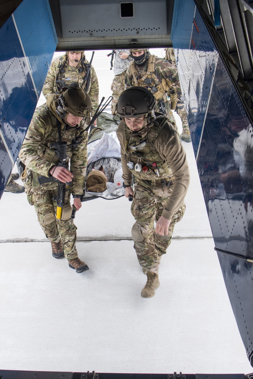 1st SOSS combat medics provide medical care to patients onboard a C-145A