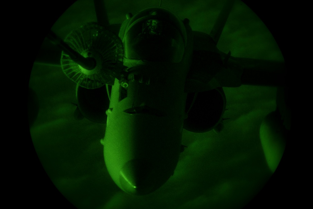 Deployed KC-10 refuels F/A-18 Hornets