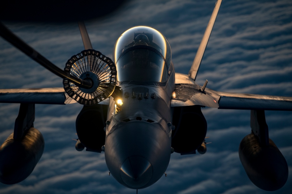 Deployed KC-10 refuels F/A-18 Hornets