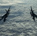 Deployed KC-10 refuels F/A-18 Hornets