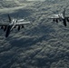 Deployed KC-10 refuels F/A-18 Hornets