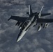 Deployed KC-10 refuels F/A-18 Hornets