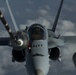 Deployed KC-10 refuels F/A-18 Hornets