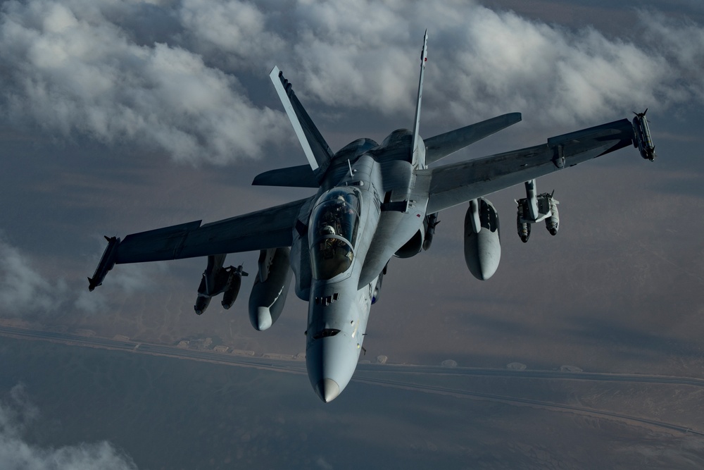 Deployed KC-10 refuels F/A-18 Hornets