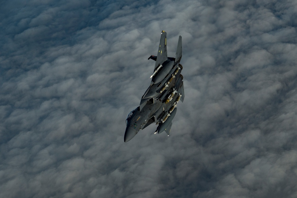 Deployed KC-10 refuels F-15 Srike Eagles