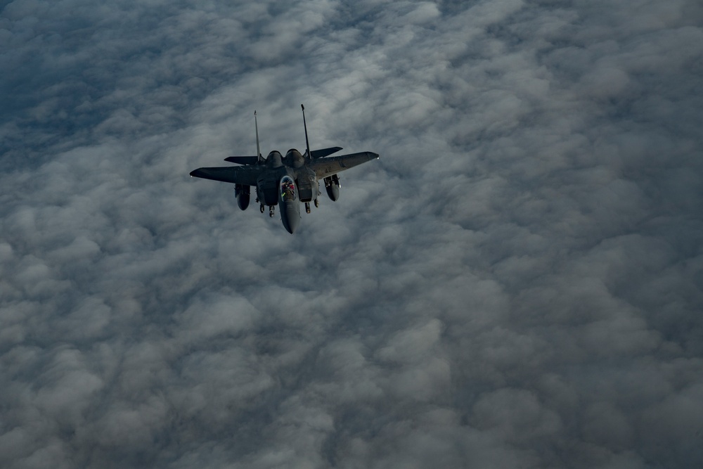 Deployed KC-10 refuels F-15 Strike Eagles