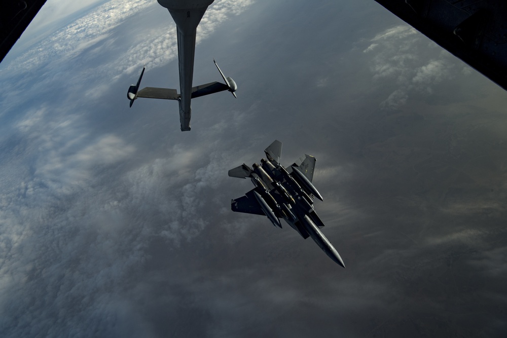 Deployed KC-10 refuels F-15 Strike Eagles