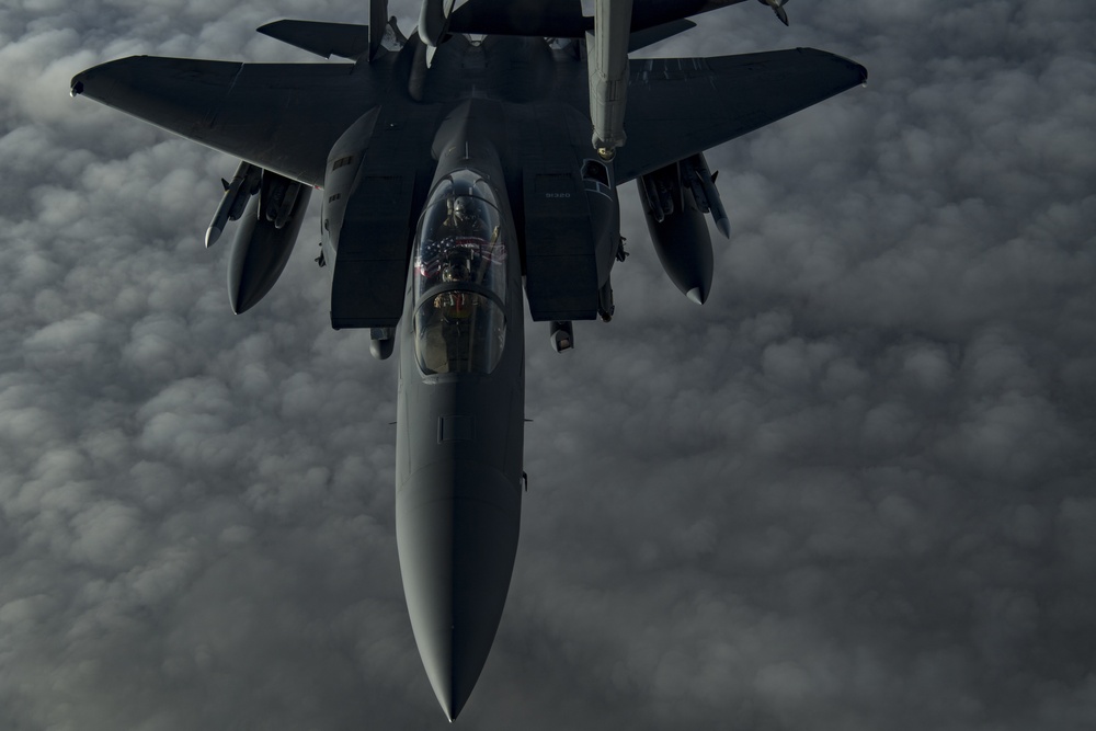 Deployed KC-10 refuels F-15 Strike Eagles