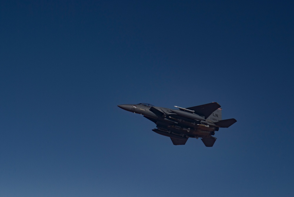 Deployed KC-10 refuels F-15 Strike Eagles