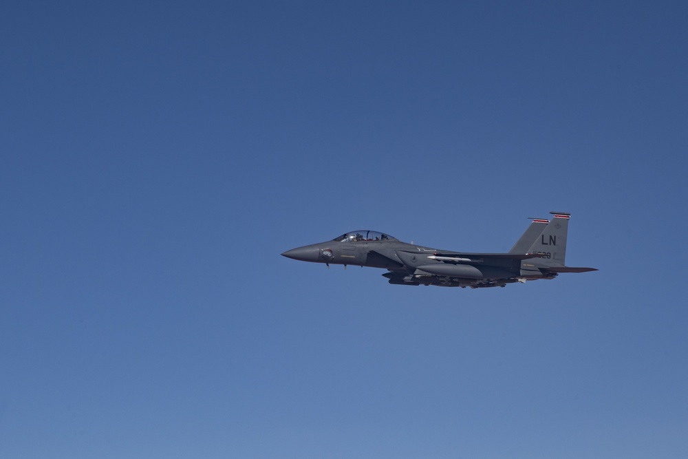 Deployed KC-10 refuels F-15 Strike Eagles