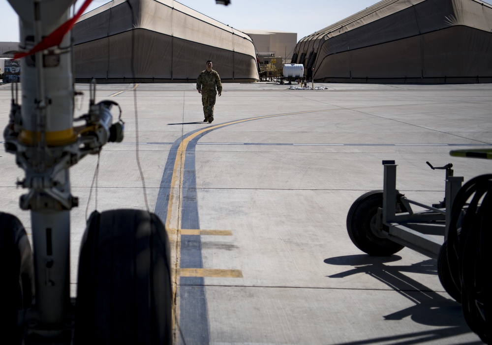 Deployed KC-10 refuels F-15 Strike Eagles