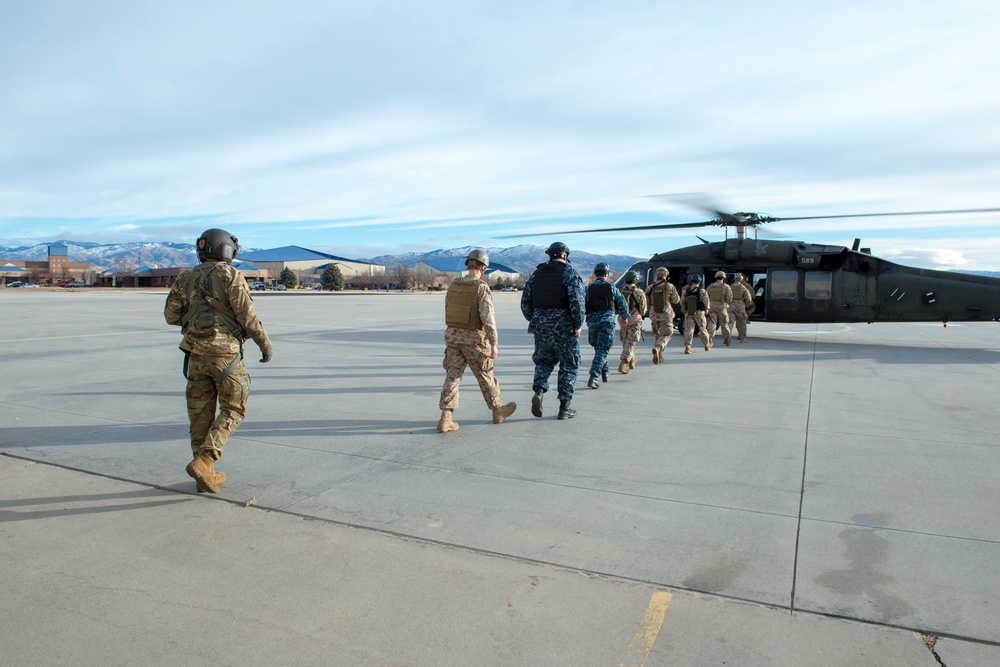 U.S. Naval Sea Cadets fly on a Black Hawk