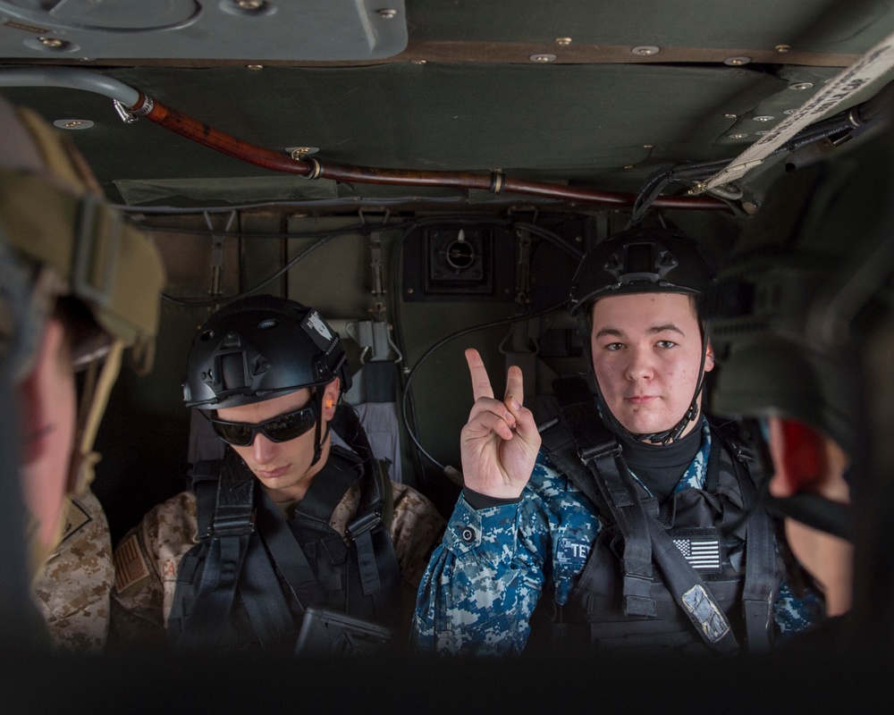 U.S. Naval Sea Cadets fly on a Black Hawk