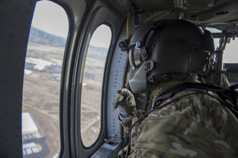 U.S. Naval Sea Cadets fly on a Black Hawk