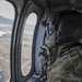 U.S. Naval Sea Cadets fly on a Black Hawk