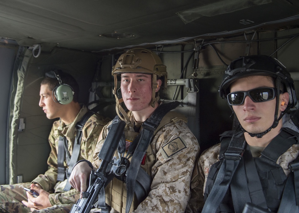 U.S. Naval Sea Cadets fly on a Black Hawk