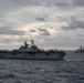 USS Green Bay (LPD 20) sails with U.S Ships