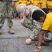 U.S. Navy Seabees with NMCB-5's Detail Pohnpei participate in the Sokehs Elementary School opening ceremony activities
