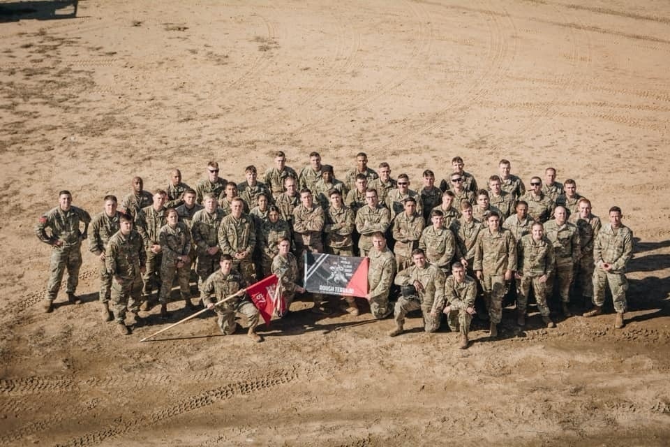 Paratroopers in 57th Sapper Company (Airborne) gather after the successful completion of the Rough Terrain Airborne Operation