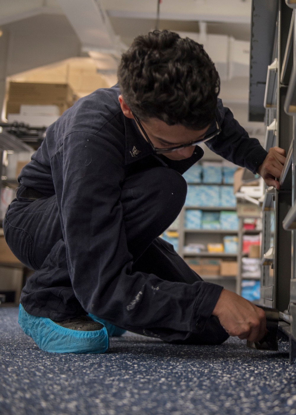 GHWB Sailor Cleans Floor