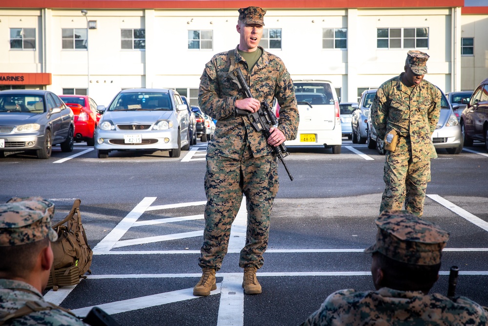 U.S. Marines with 12th Marine Regiment conduct a conditioning hike