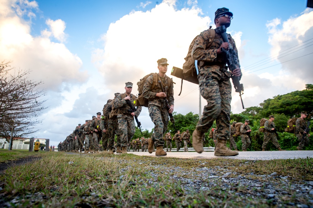 U.S. Marines with 12th Marine Regiment conduct a conditioning hike