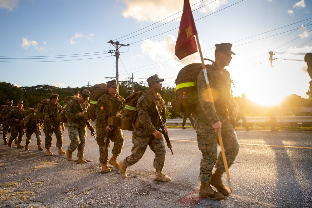 U.S. Marines with 12th Marine Regiment conduct a conditioning hike