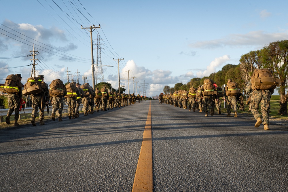 U.S. Marines with 12th Marine Regiment conduct a conditioning hike