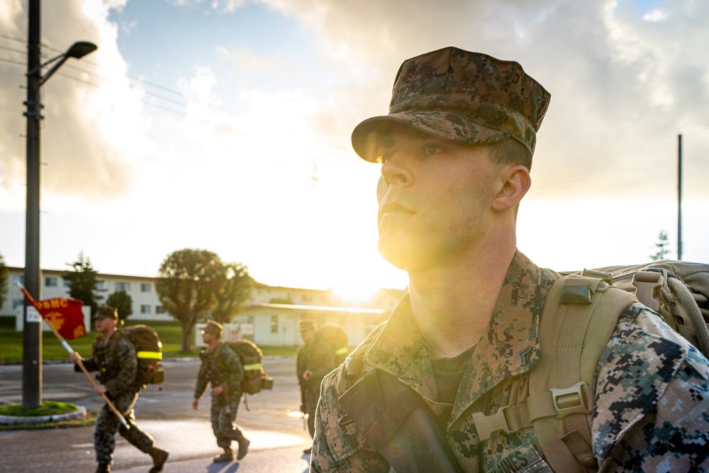 U.S. Marines with 12th Marine Regiment conduct a conditioning hike