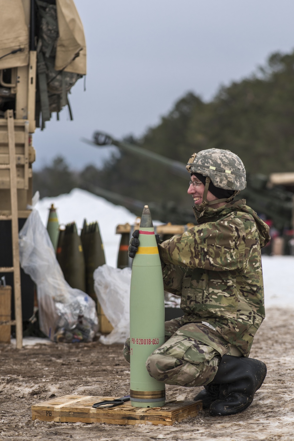 Specialist Nathan Kline trains during field artillery exercises
