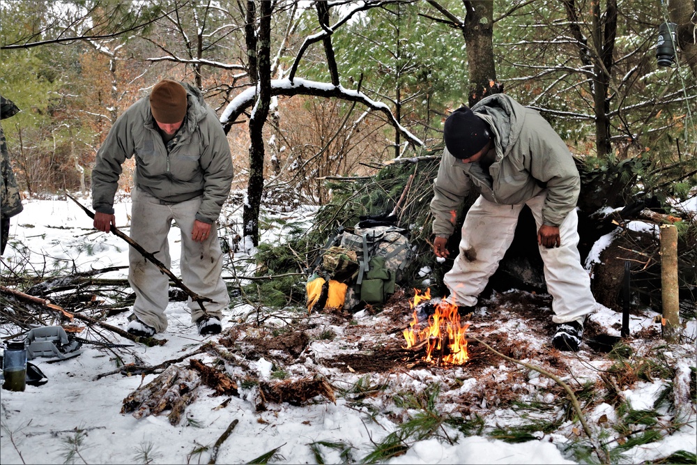 Cold-Weather Operations Course Class 20-02 students conduct field ops, improvised shelter construction