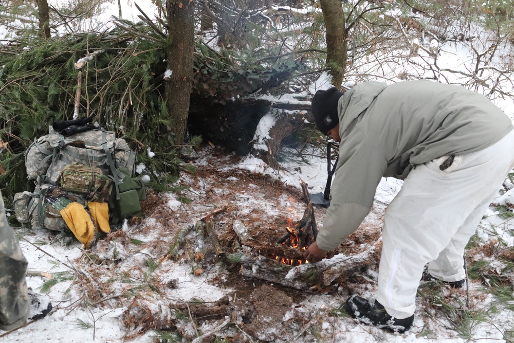 Cold-Weather Operations Course Class 20-02 students conduct field ops, improvised shelter construction