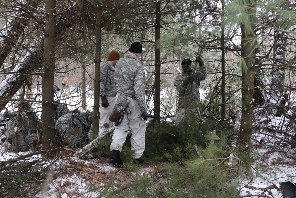 Cold-Weather Operations Course Class 20-02 students conduct field ops, improvised shelter construction