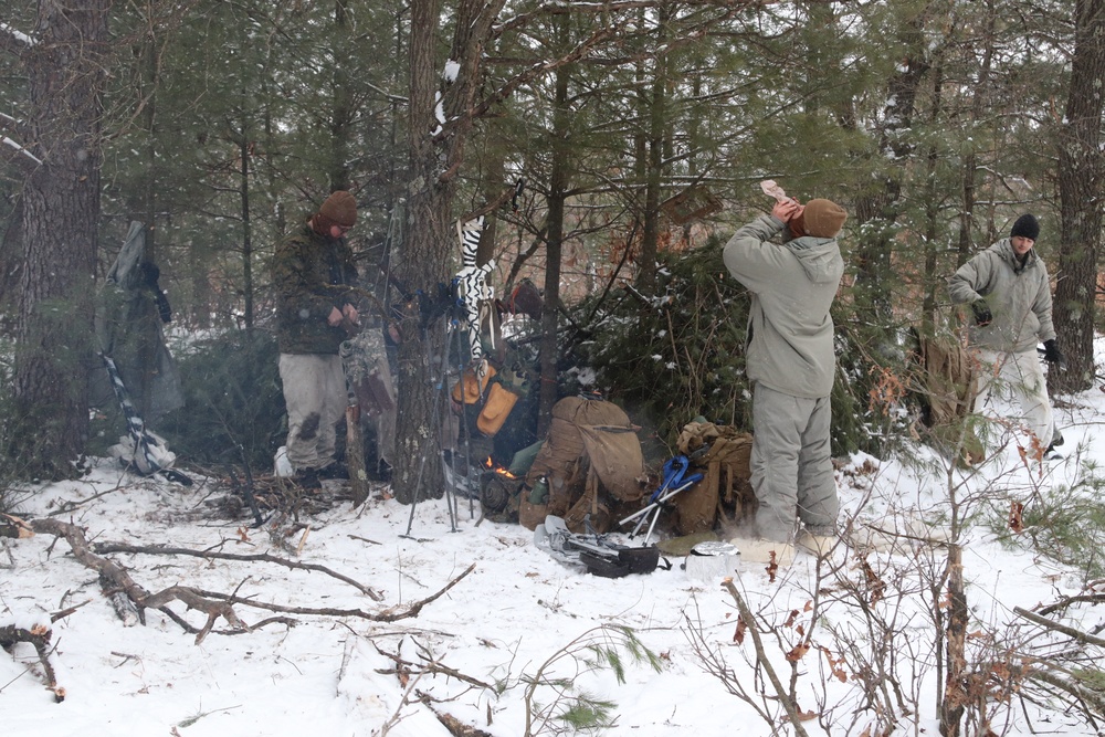 Cold-Weather Operations Course Class 20-02 students conduct field ops, improvised shelter construction