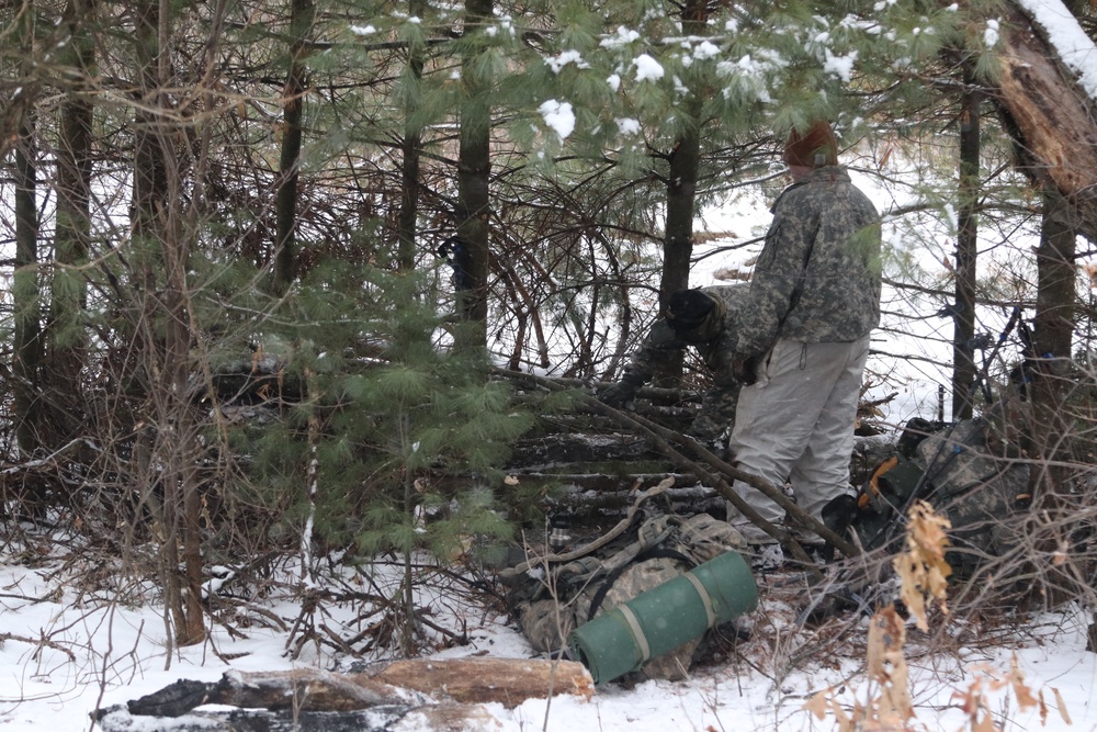 Cold-Weather Operations Course Class 20-02 students conduct field ops, improvised shelter construction