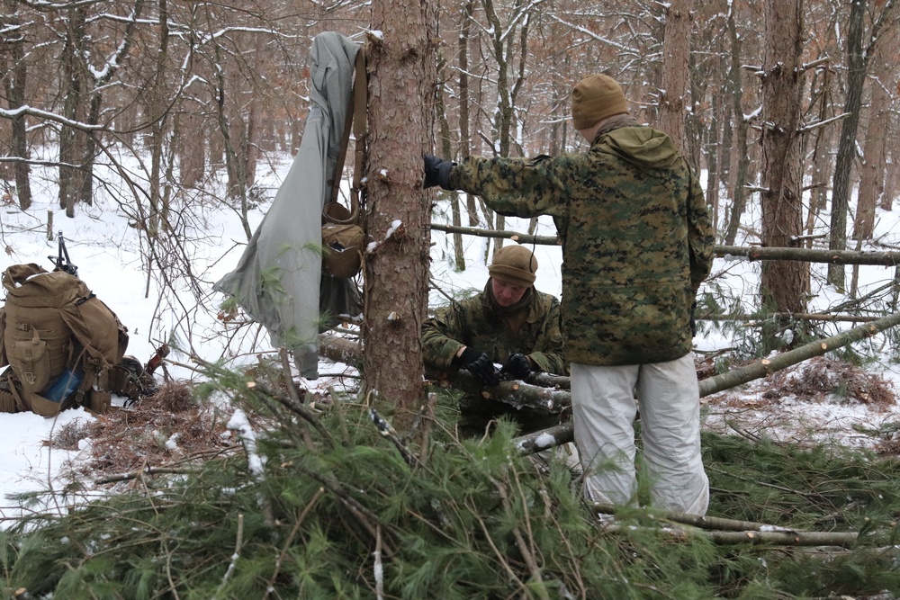 Cold-Weather Operations Course Class 20-02 students conduct field ops, improvised shelter construction