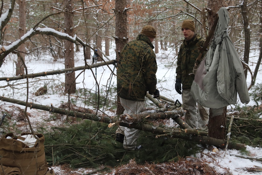 Cold-Weather Operations Course Class 20-02 students conduct field ops, improvised shelter construction