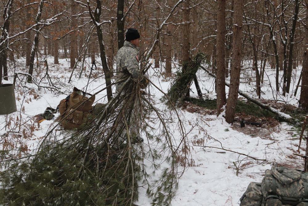 Cold-Weather Operations Course Class 20-02 students conduct field ops, improvised shelter construction