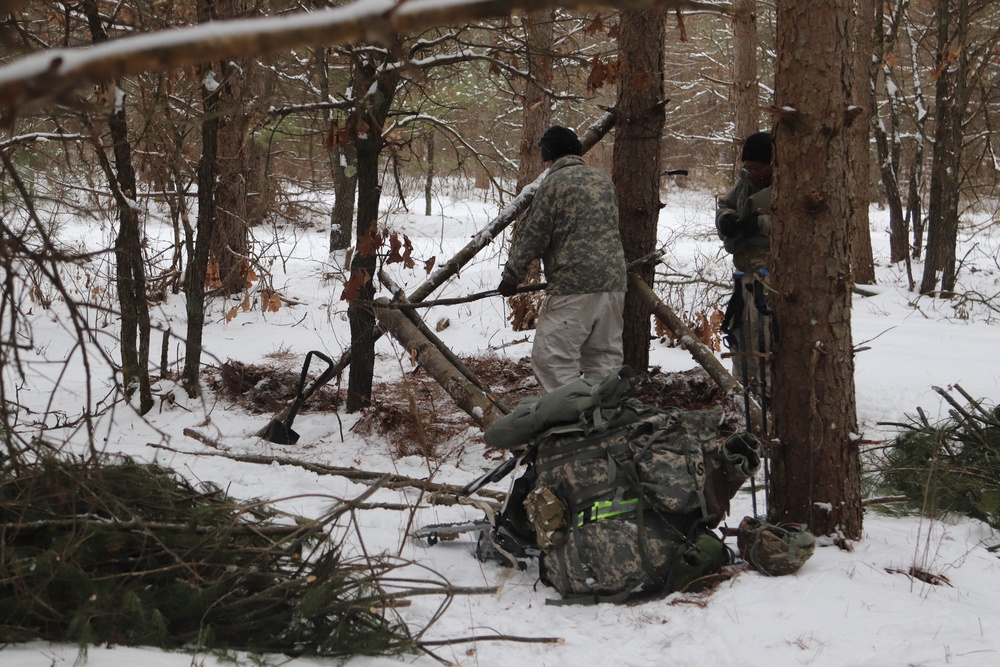 Cold-Weather Operations Course Class 20-02 students conduct field ops, improvised shelter construction