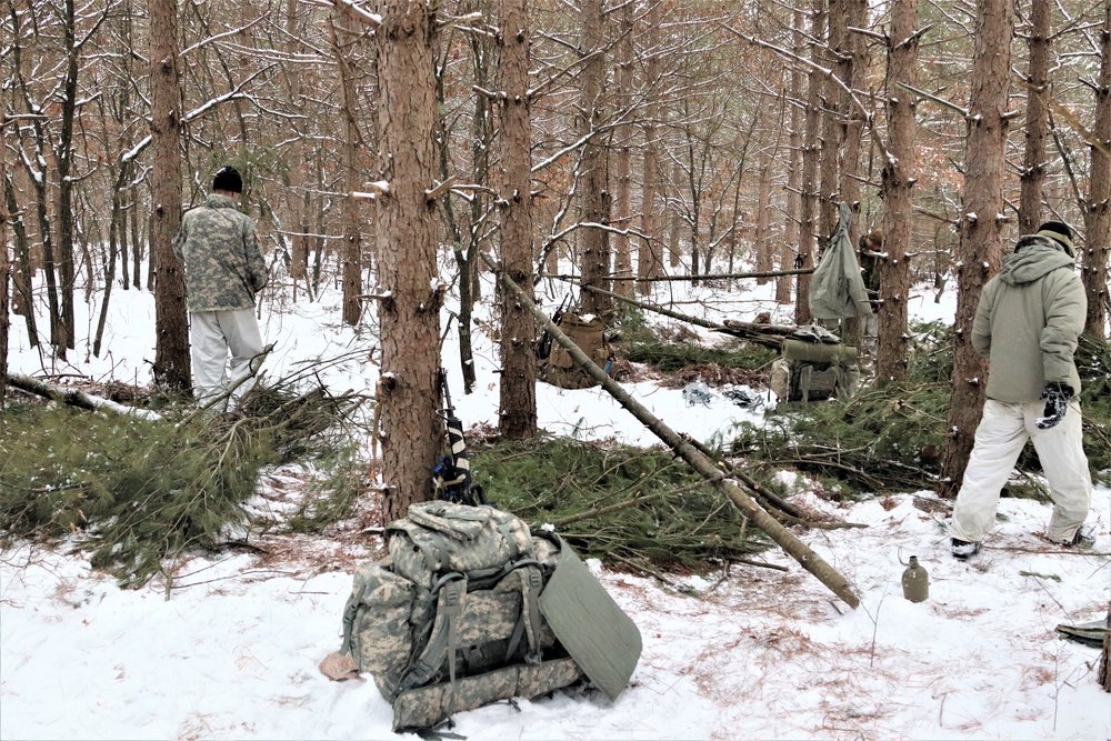 Cold-Weather Operations Course Class 20-02 students conduct field ops, improvised shelter construction