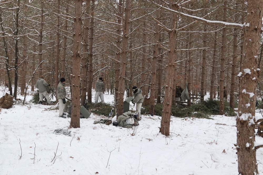 Cold-Weather Operations Course Class 20-02 students conduct field ops, improvised shelter construction