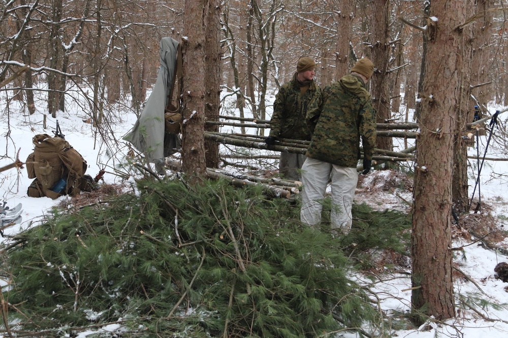 Cold-Weather Operations Course Class 20-02 students conduct field ops, improvised shelter construction